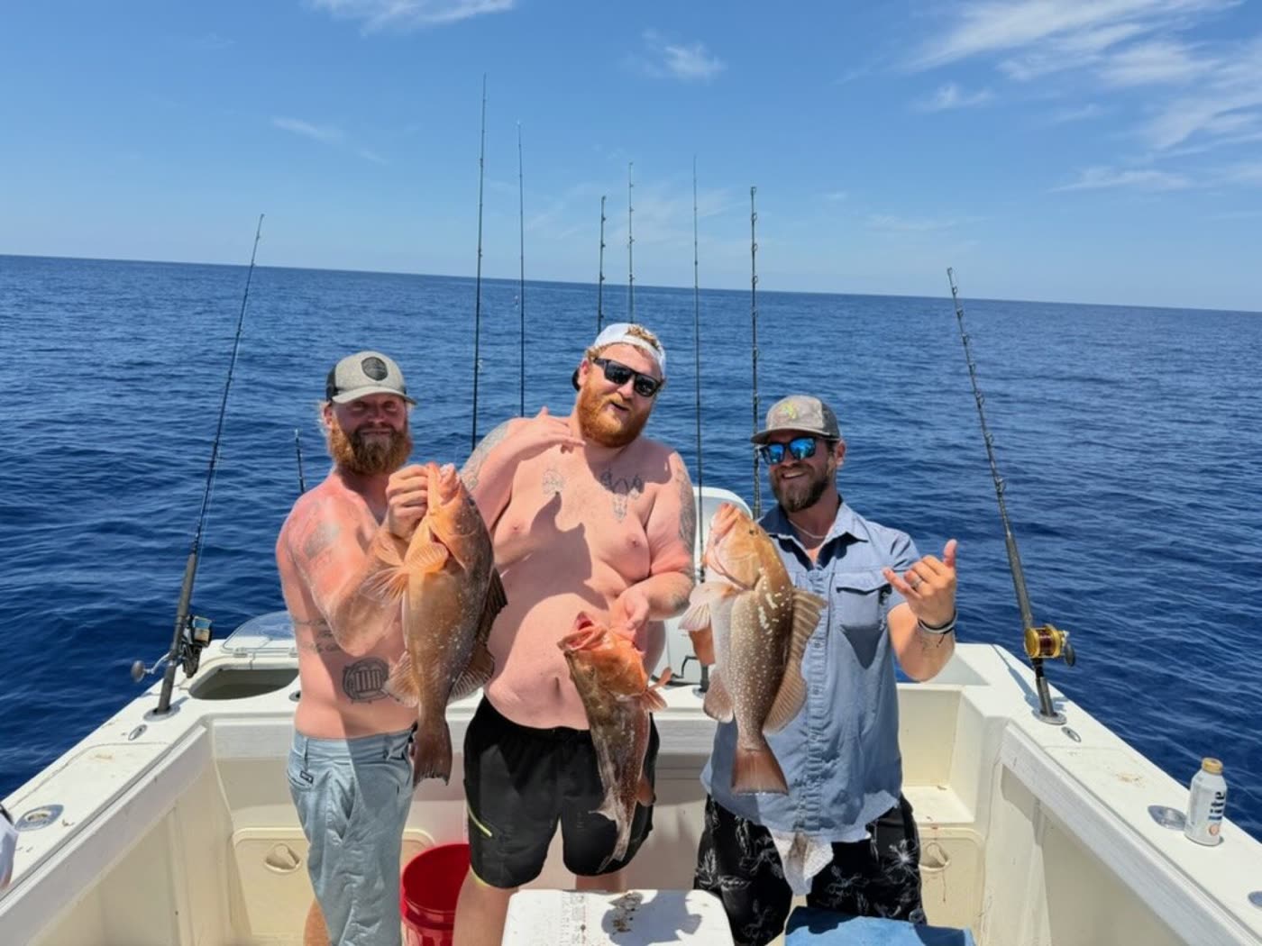 Three red grouper on deck